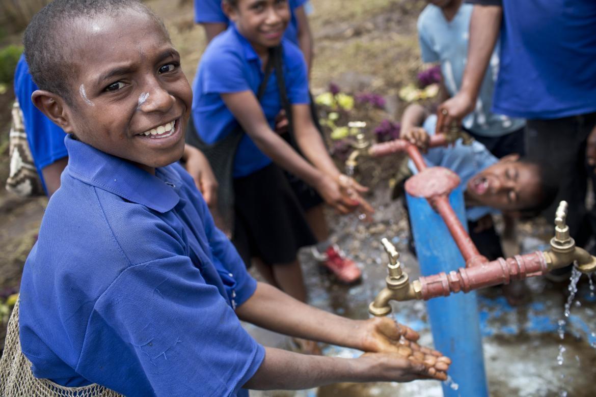 Children demonstrate how to wash their hands for Karin Hulshof, UNICEF regional director for east Asia and the Pacific, on a school visit to Topa, Mendi, Papua New Guinea Thursday, March 14, 2019. Credit: Kateholtphoto