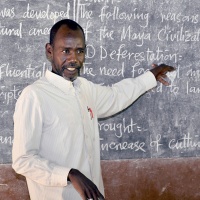 Teacher Adam Gabriel gives a history lesson at St. Bakhita Primary School. Credit: GPE/Jok Solomon
